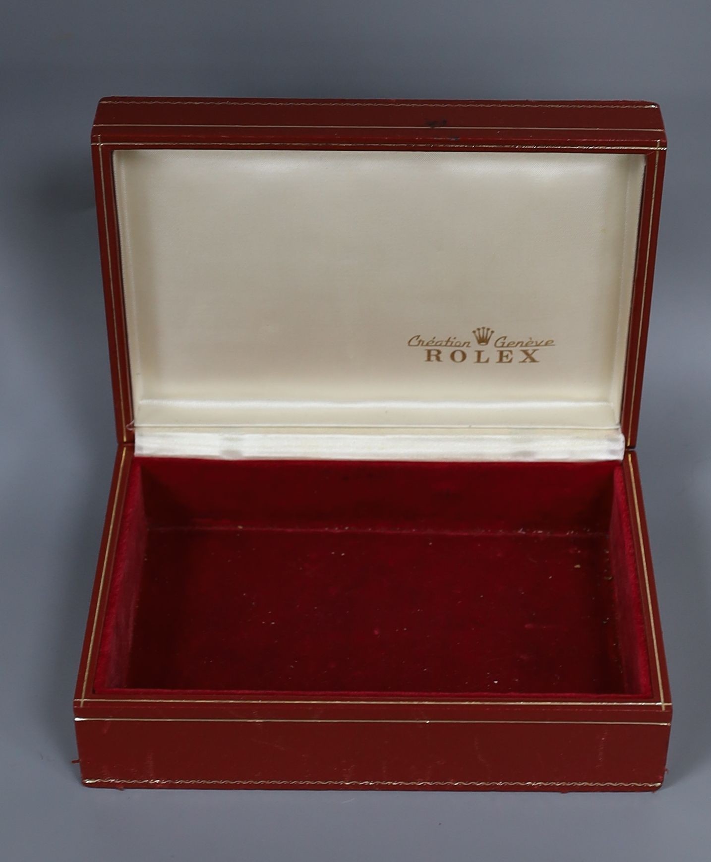 A Rolex gilt tooled and fabric covered lid, red leather wrist watch box, 18cm